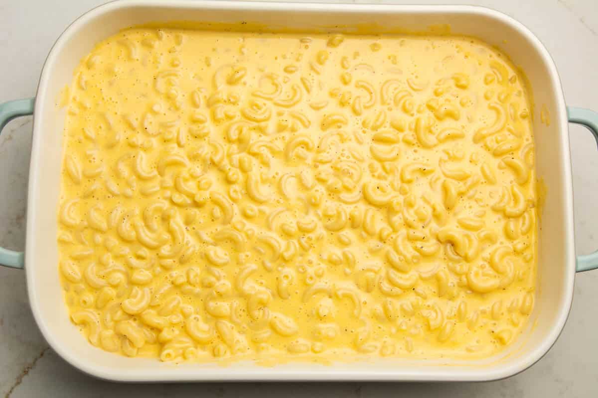 Creamy mac and cheese with Velveeta in a baking dish before it is baked.