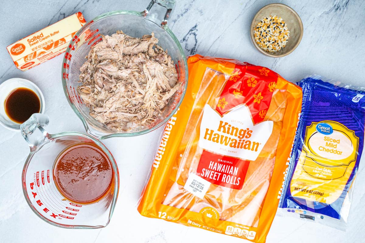 Ingredients for barbecue pulled pork sliders on a table.