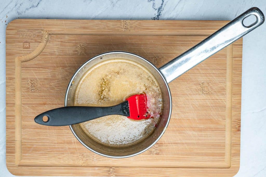 A butter mixture with Worcestershire sauce and Everything But The Bagel Seasoning in a small saucepan.
